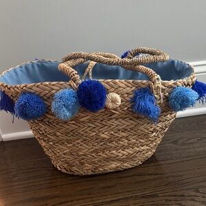 Woven Basket with Blue Pom Poms